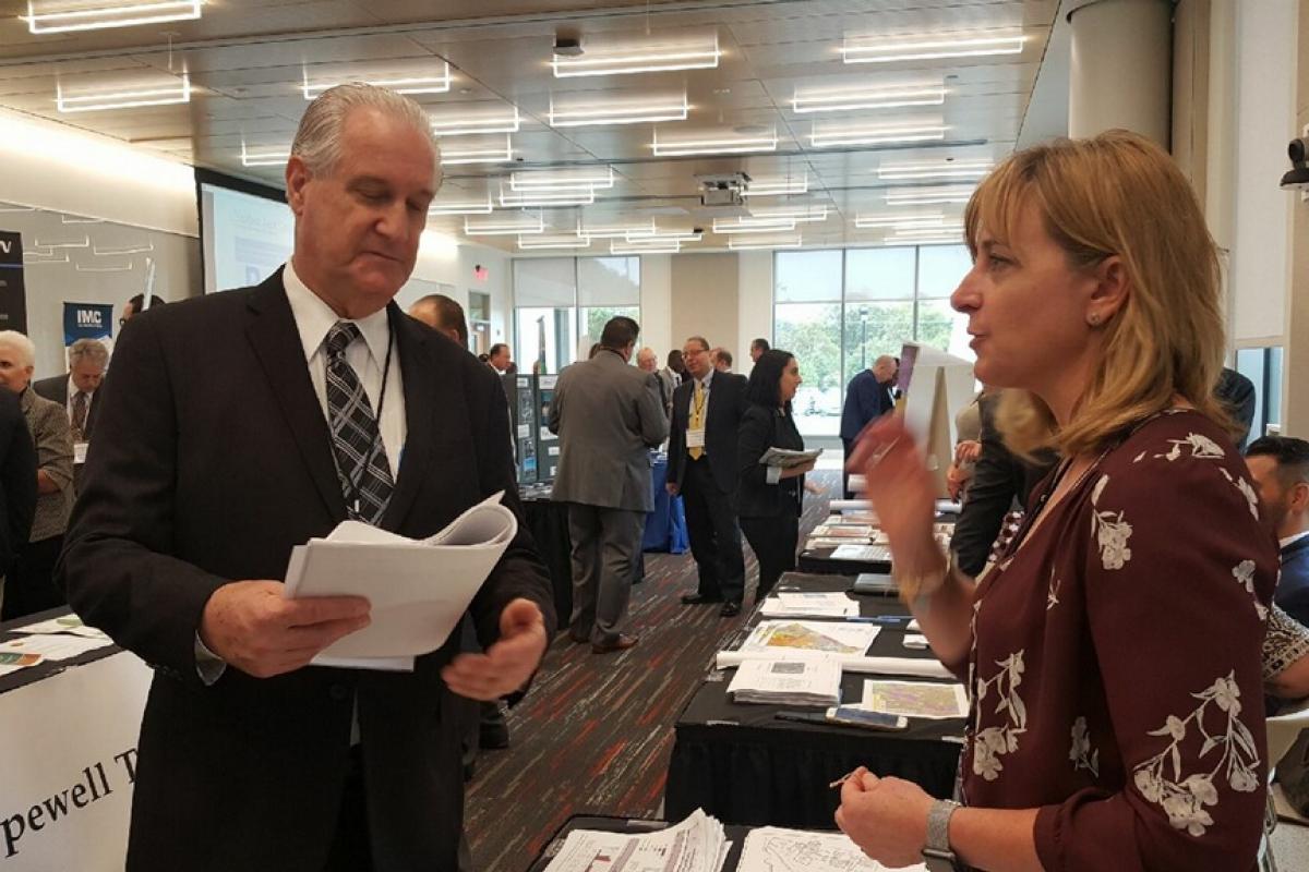 Administrator Maria Carrington speaking with David Wyche 